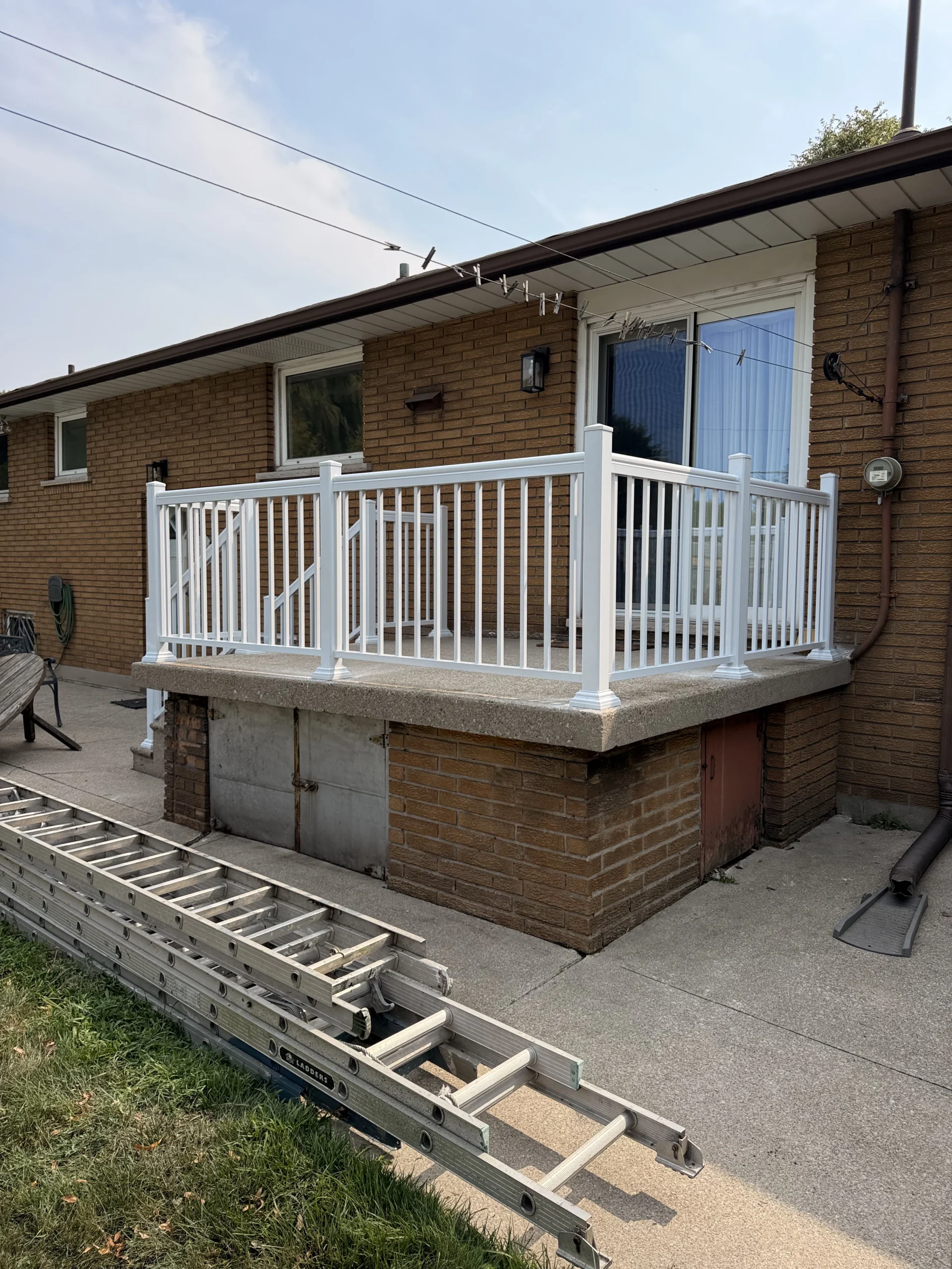 Photo-brick-house-white-deck-exterior-renovation