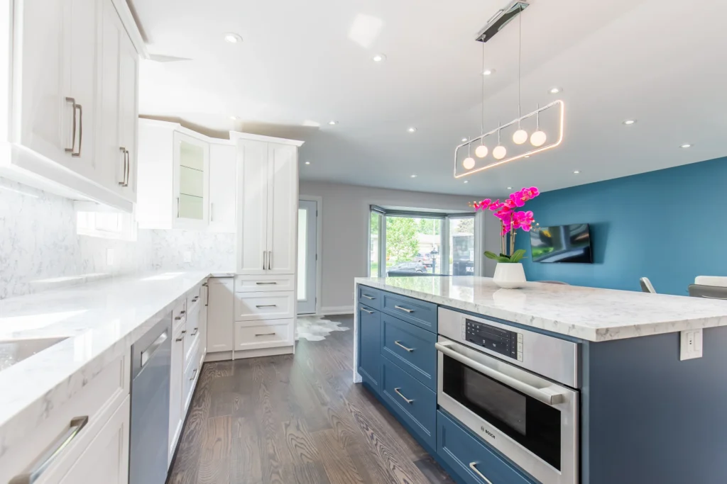 photo-of-a-completed-kitchen-renovation-checklist-result-featuring-white-shaker-cabinets-blue-island-marble-countertops-and-dark-hardwood-floors