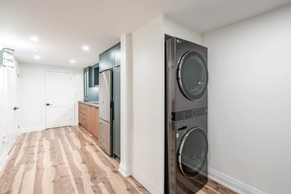Photo basement suite teal kitchen reasons to renovate your home washer dryer