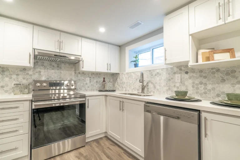 Photo renovated kitchen with hexagon backsplash and stainless appliances