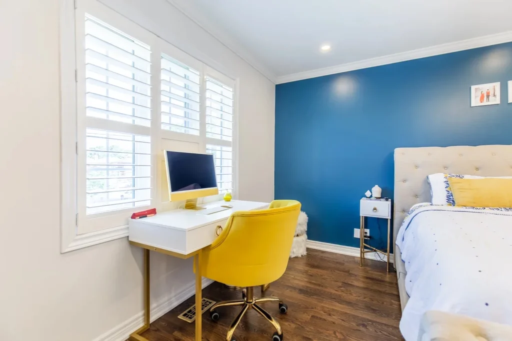 Photo bedroom with desk showing where to stay during home renovation