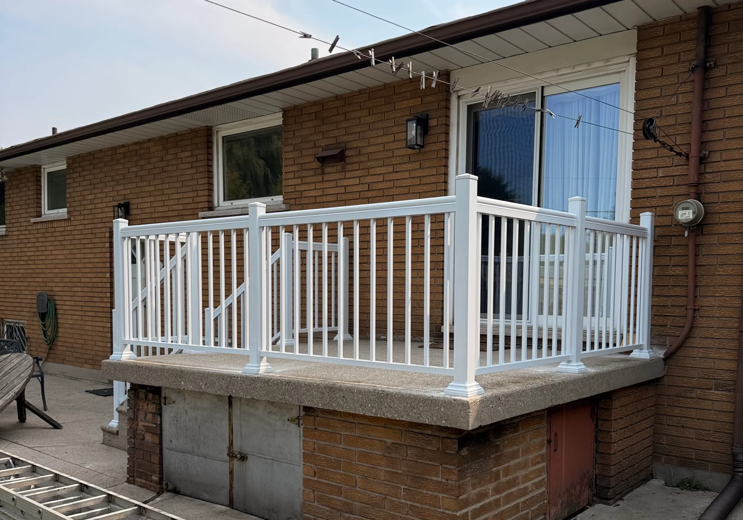 Photo of white vinyl deck railing exterior renovation